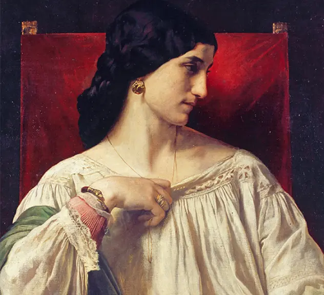 Ein Gemälde von Anselm Feuerbach mit dem Titel 'Bildnis der Nanna'. Das Porträt zeigt eine junge Frau mit dunklem Haar, die seitlich auf einem roten Stuhl sitzt. Sie trägt ein weißes, locker sitzendes Kleid mit einem grünen Umhang und goldene Ohrringe. Ihr nachdenklicher Ausdruck und die detaillierte Darstellung ihrer Kleidung und Schmuckstücke betonen ihre Eleganz und Anmut.